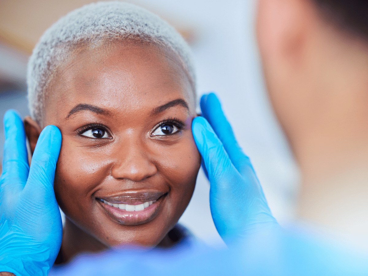 closeup of woman being examined by doctor