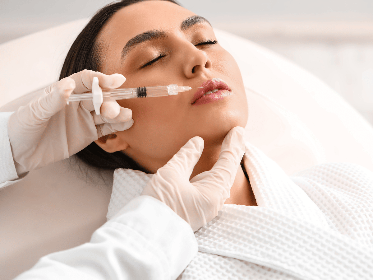 a woman getting a facial treatment